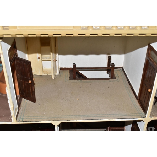 510 - A VINTAGE THREE-STOREY DOLLS HOUSE to include a nine room house with wooden dolls furniture, a magne... 