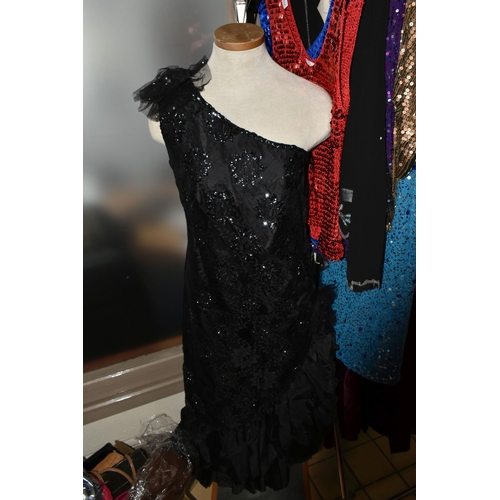 513 - A LARGE QUANTITY OF LADIES' EVENING DRESSES, FAUX FUR JACKETS, AND TOPS to include a vintage purple ... 