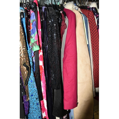 513 - A LARGE QUANTITY OF LADIES' EVENING DRESSES, FAUX FUR JACKETS, AND TOPS to include a vintage purple ... 