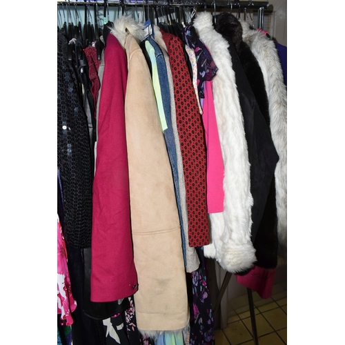 513 - A LARGE QUANTITY OF LADIES' EVENING DRESSES, FAUX FUR JACKETS, AND TOPS to include a vintage purple ... 