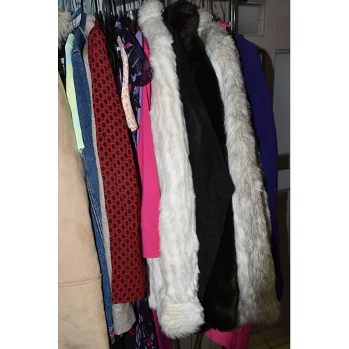 513 - A LARGE QUANTITY OF LADIES' EVENING DRESSES, FAUX FUR JACKETS, AND TOPS to include a vintage purple ... 