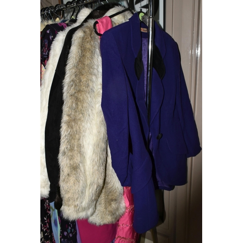 513 - A LARGE QUANTITY OF LADIES' EVENING DRESSES, FAUX FUR JACKETS, AND TOPS to include a vintage purple ... 