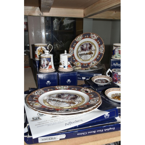 525 - A COLLECTION OF AYNSLEY ROYAL COMMEMORATIVE CERAMICS, to include bells, mugs, plates and a loving cu... 