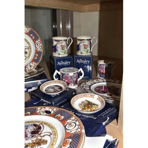 525 - A COLLECTION OF AYNSLEY ROYAL COMMEMORATIVE CERAMICS, to include bells, mugs, plates and a loving cu... 