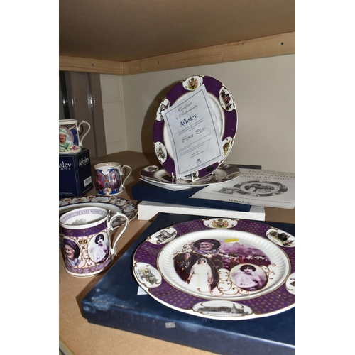 525 - A COLLECTION OF AYNSLEY ROYAL COMMEMORATIVE CERAMICS, to include bells, mugs, plates and a loving cu... 