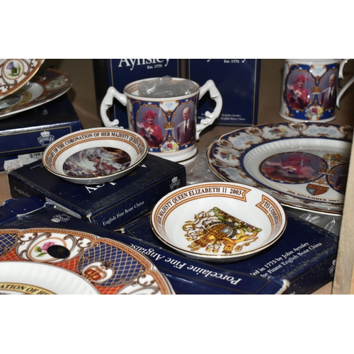 525 - A COLLECTION OF AYNSLEY ROYAL COMMEMORATIVE CERAMICS, to include bells, mugs, plates and a loving cu... 