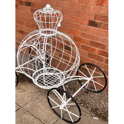 1011 - A PAINTED WIRE CINDERELLA CARRIAGE PLANTER, complete with a crown top and wheels, length 127cm x dep... 