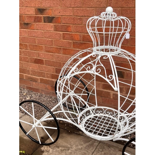 1011 - A PAINTED WIRE CINDERELLA CARRIAGE PLANTER, complete with a crown top and wheels, length 127cm x dep... 