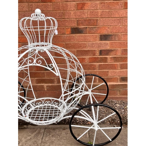 1011 - A PAINTED WIRE CINDERELLA CARRIAGE PLANTER, complete with a crown top and wheels, length 127cm x dep... 