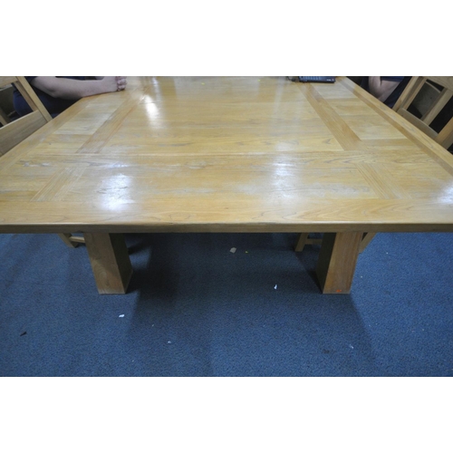 1195 - A LARGE SQUARE OAK DINNG TABLE, raised on thick square tapered legs, 180cm squared x height 78cm, al... 