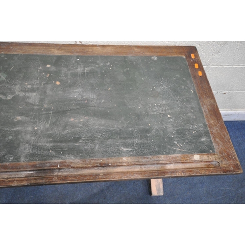 1196 - IN THE MANNER OF A.W.N PUGIN, A 20TH CENTURY OAK SLIM LIBRARY TABLE, with a green leather writing su... 