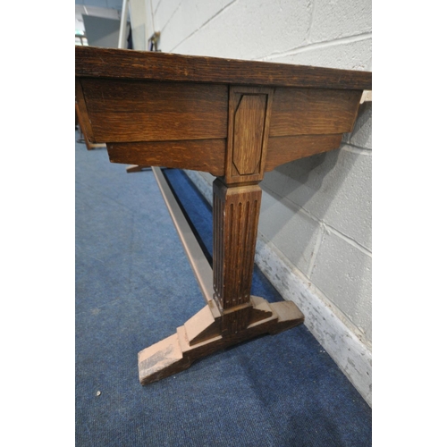 1196 - IN THE MANNER OF A.W.N PUGIN, A 20TH CENTURY OAK SLIM LIBRARY TABLE, with a green leather writing su... 