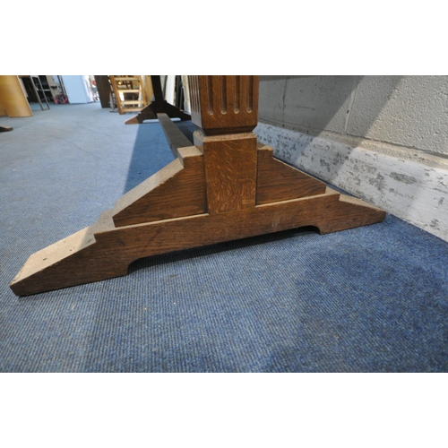 1197 - IN THE MANNER OF A.W.N PUGIN, A LARGE 20TH CENTURY OAK LIBRARY TABLE, with a tanned leather writing ... 