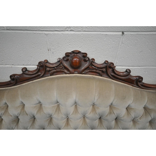 1200 - A VICTORIAN MAHOGANY FRAMED SOFA, the decorative frame with foliate scrolls, crest to top centre, bu... 