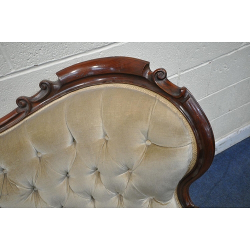 1200 - A VICTORIAN MAHOGANY FRAMED SOFA, the decorative frame with foliate scrolls, crest to top centre, bu... 