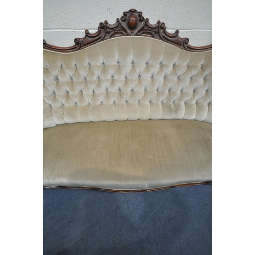 1200 - A VICTORIAN MAHOGANY FRAMED SOFA, the decorative frame with foliate scrolls, crest to top centre, bu... 