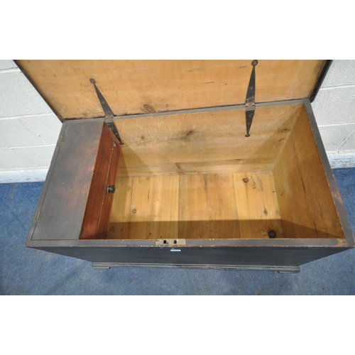 1220 - A STAINED PINE BLANKET CHEST, the hinged lid enclosing a candle box and a single drawer, twin metal ... 