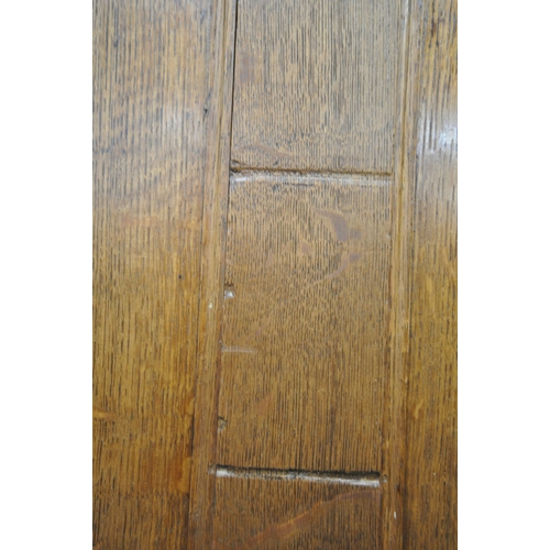 1227 - A GEORGIAN OAK HOUSEKEEPERS CUPBOARD, the double sliding doors enclosing a white painted interior, a... 