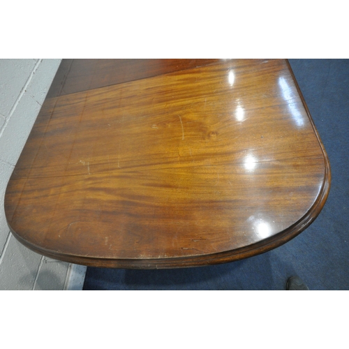 1233 - A LARGE VICTORIAN MAHOGANY WIND OUT DINING TABLE, with two additional leaves, raised on turned and t... 