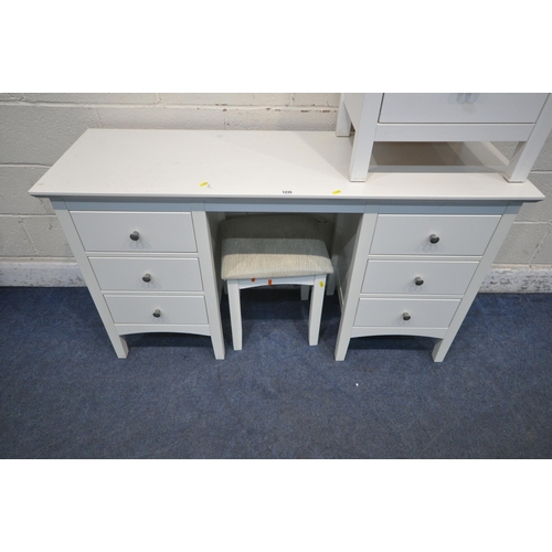 1235 - A MODERN WHITE DRESSING TABLE, with six drawers, length 137cm x depth 45cm x height 78cm, a dressing... 