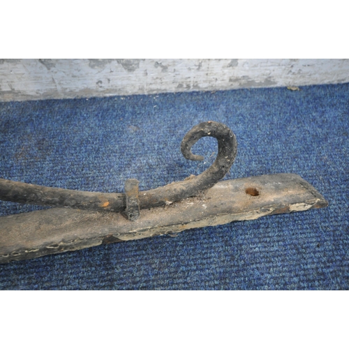 1253 - A 19TH CENTURY CAST IRON SHOP SIGN WALL BRACKET, length 138cm x height 81cm (condition report: histo... 