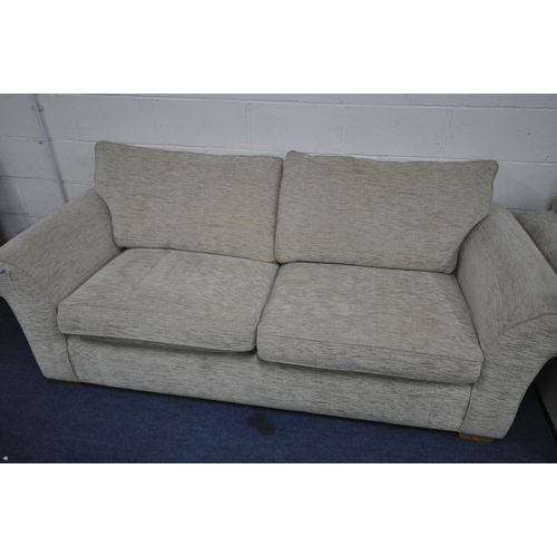 1263 - A OATMEAL UPHOLSTERED TWO PIECE LOUNGE SUITE, comprising of two different sized, two seater settee's... 