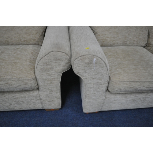 1263 - A OATMEAL UPHOLSTERED TWO PIECE LOUNGE SUITE, comprising of two different sized, two seater settee's... 