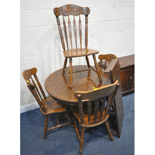 1289 - A LATE 20TH CENTURY OAK EXTENDING TABLE, raised on a single pedestal with four legs, with one additi... 