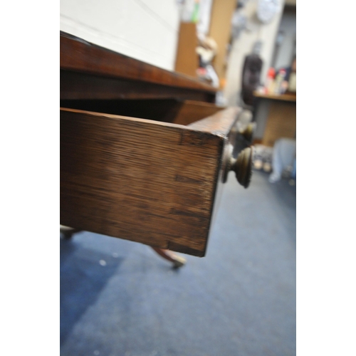 1292 - A GEORGIAN MAHOGANY DROP LEAF SOFA TABLE, with two frieze drawers, raised on twin supports and shape... 