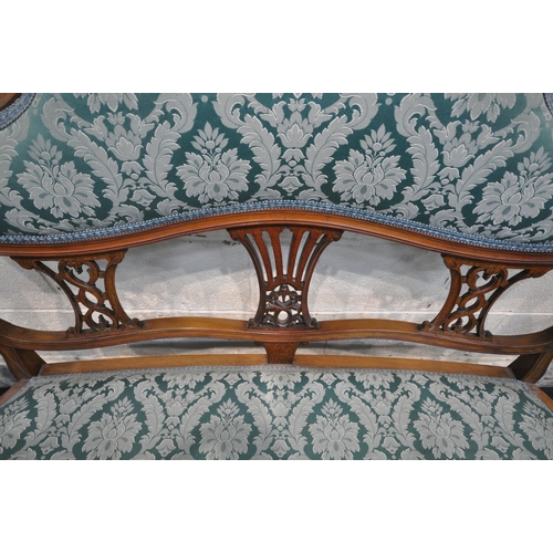 1298 - AN EDWARDIAN WALNUT THREE PIECE SUITE, with shaped foliate crests, splat backs, swept open armrests,... 