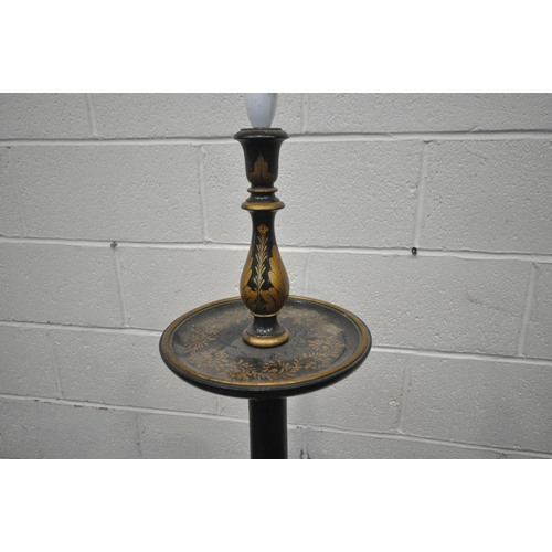 1301 - AN EBONISED AND CHINOISERIE STANDARD LAMP, with a small dished shelf, depicting bamboo, people, flow... 