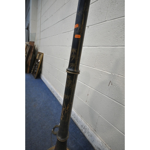 1301 - AN EBONISED AND CHINOISERIE STANDARD LAMP, with a small dished shelf, depicting bamboo, people, flow... 