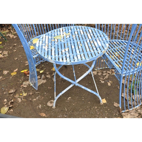 1012 - A PAIR OF PAINTED METAL WIRE FRAME CHAIRS with flared and tapering sides and a similar folding table... 