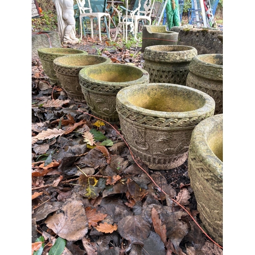 1016 - A SET OF FIVE WEATHERED COMPOSITE CIRCULAR PLANTERS, 34cm in diameter