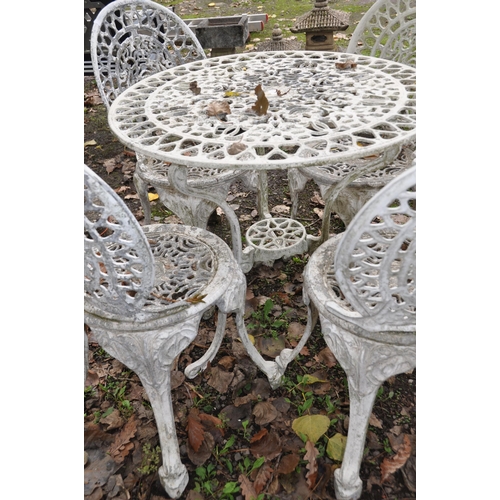 1017 - A PAINTED CAST ALUMINIUM GARDEN TABLE, diameter 77cm, and four matching chairs (5)