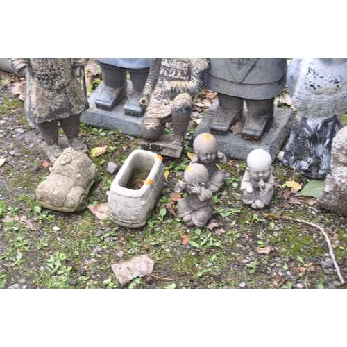 1023 - A SELECTION OF MODERN COMPOSITE GARDEN FIGURES, including a Buddha, an owl, a set of three oriental ... 