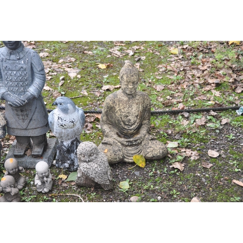 1023 - A SELECTION OF MODERN COMPOSITE GARDEN FIGURES, including a Buddha, an owl, a set of three oriental ... 