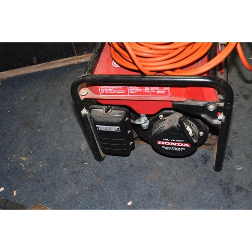 1066 - A HONDA EM2200 PETROL GENERATOR with 240v, 110v and 12v outlets and a 240v extension lead (engine pu... 