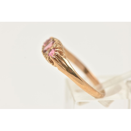 13 - A 9CT GOLD PINK TOURMALINE AND DIAMOND RING, set with a central oval cut pink tourmaline, flanked wi... 