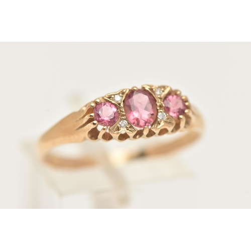 13 - A 9CT GOLD PINK TOURMALINE AND DIAMOND RING, set with a central oval cut pink tourmaline, flanked wi... 