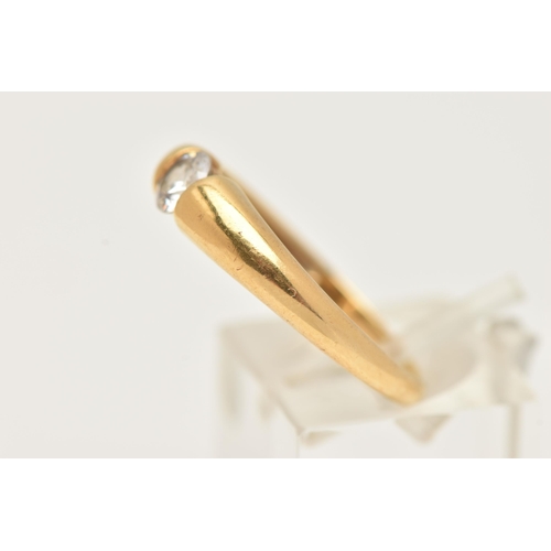 14 - AN 18CT GOLD SINGLE STONE RING, set with a colourless circular cut cubic zirconia, tension set to a ... 