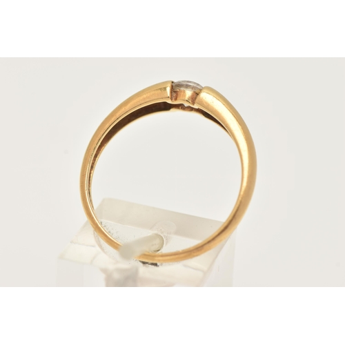 14 - AN 18CT GOLD SINGLE STONE RING, set with a colourless circular cut cubic zirconia, tension set to a ... 