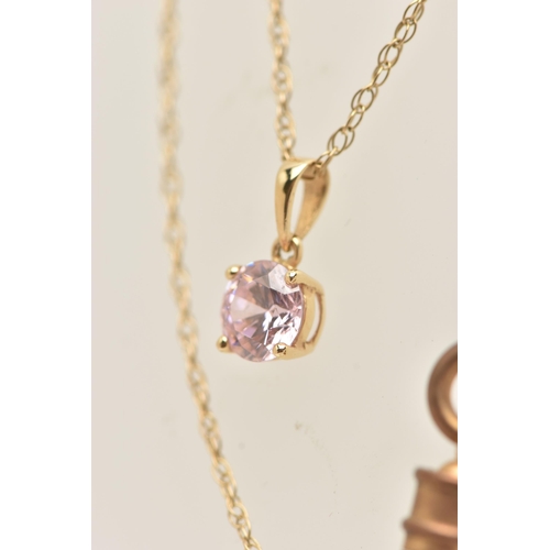 17 - A YELLOW METAL PENDANT NECKLACE, the pendant set with a circular cut pink cubic zirconia, in a four ... 