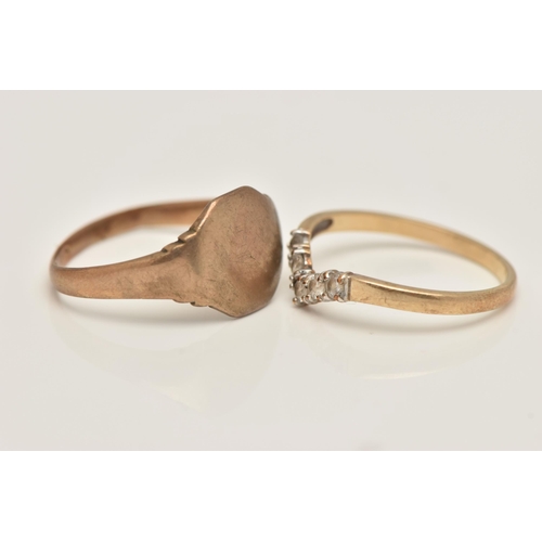 28 - TWO 9CT GOLD RINGS, the first a wish bone ring set with colourless cubic zirconia, polished band, ha... 