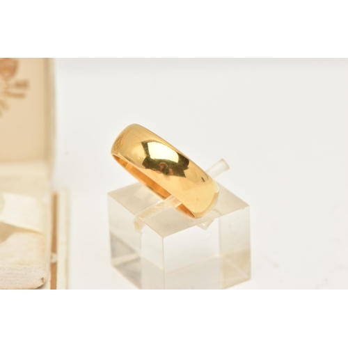 29 - A 22CT GOLD WEDDING BAND RING, designed as a plain polished D-shape cross-section band, hallmarked 2... 