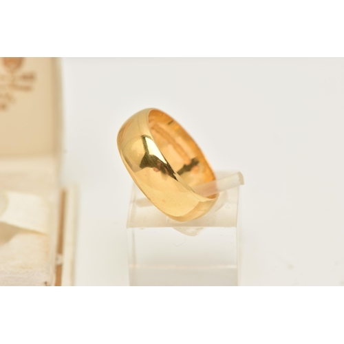 29 - A 22CT GOLD WEDDING BAND RING, designed as a plain polished D-shape cross-section band, hallmarked 2... 