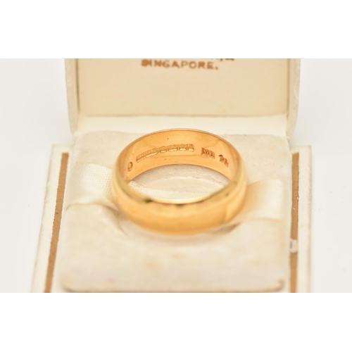 29 - A 22CT GOLD WEDDING BAND RING, designed as a plain polished D-shape cross-section band, hallmarked 2... 