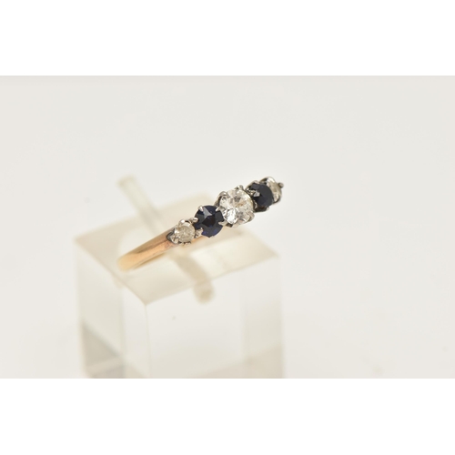 33 - A GEM SET FIVE STONE RING, set with two graduating synthetic blue sapphires and colourless gemstones... 