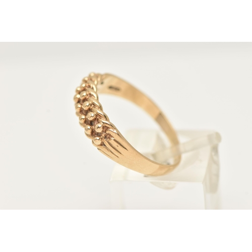 36 - A 9CT YELLOW GOLD KEEPERS RING, hallmarked 9ct gold London 1988, sponsors marks A & Co, ring size U ... 