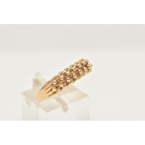 36 - A 9CT YELLOW GOLD KEEPERS RING, hallmarked 9ct gold London 1988, sponsors marks A & Co, ring size U ... 